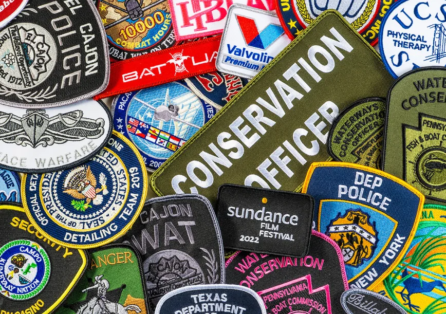 Graphic comparison showing the resolution differences of sublimated printed patches vs embroidered patches